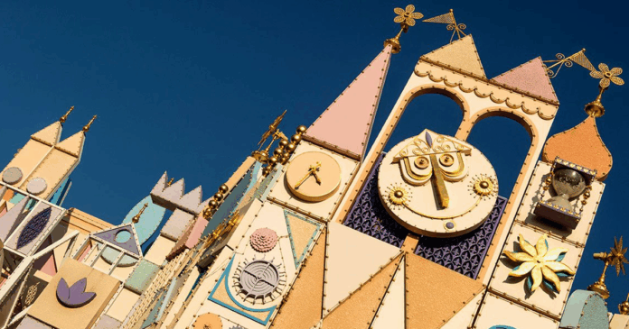 he colorful, iconic facade of the "it's a small world" attraction, symbolizing its enduring message of unity and its upcoming new finale lyrics.